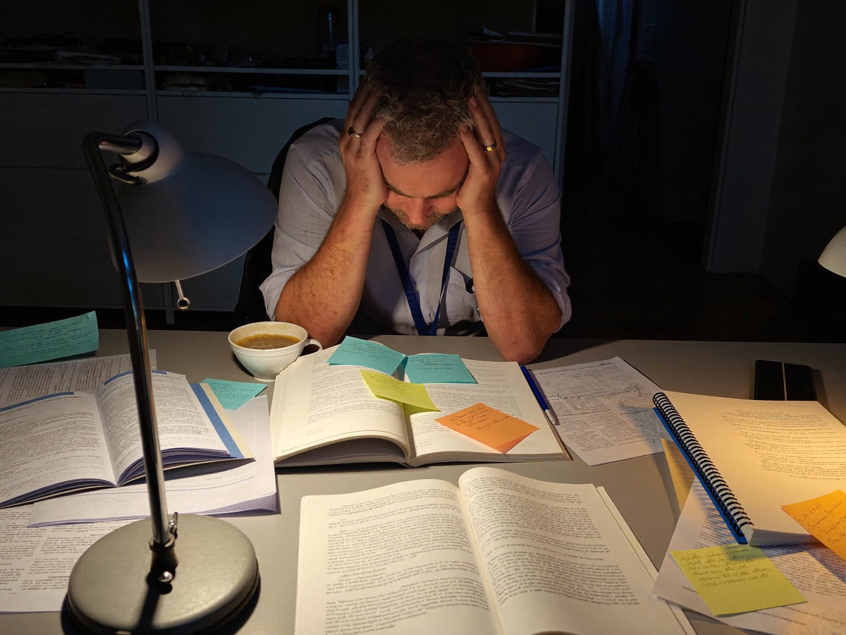 A researcher late over his studies Image