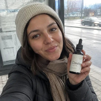 A customer holding a Dawtox bottle Image