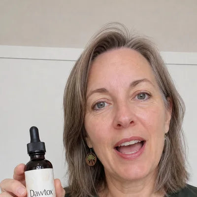 A customer holding a Dawtox bottle Image
