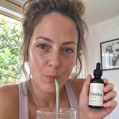 A customer holding a Dawtox bottle Image