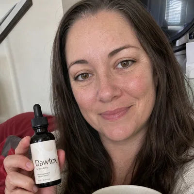 A customer holding a Dawtox bottle Image