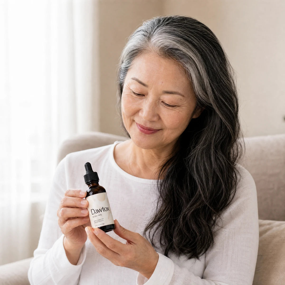 A customer looking at a Dawtox bottle at home Image